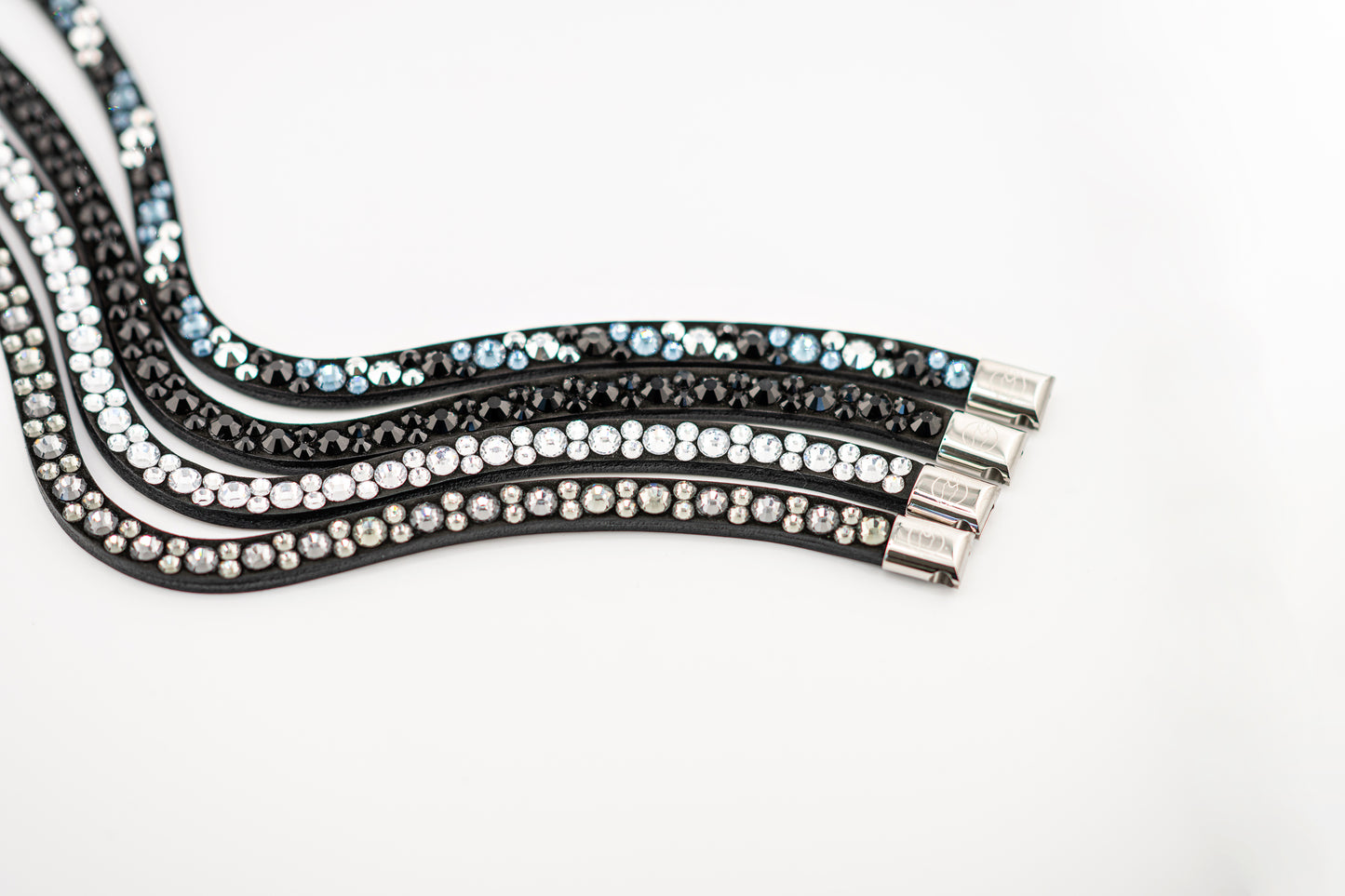 Horse browband Crystal mini by IBV Equine
Dive into a world of possibilities:
* Combine any colors and sizes from our expansive palette.
* Choose from four distinct rhinestone shapes.
* Explore four unique layout options.
* Select from more than 30 dazzling rhinestone colors.
* Please contact us to create your own design.
Each rhinestone is meticulously set on a durable nubuck backing, ensuring vibrant sparkle. Our innovative attachment process uses specialized hot glue, creating an incredibly robust bon