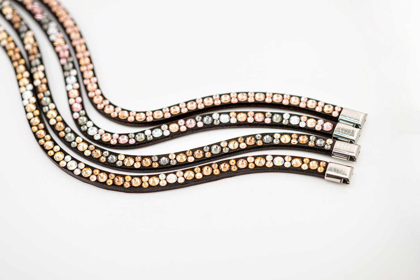 Horse browband Crystal mini by IBV Equine
Dive into a world of possibilities:
* Combine any colors and sizes from our expansive palette.
* Choose from four distinct rhinestone shapes.
* Explore four unique layout options.
* Select from more than 30 dazzling rhinestone colors.
* Please contact us to create your own design.
Each rhinestone is meticulously set on a durable nubuck backing, ensuring vibrant sparkle. Our innovative attachment process uses specialized hot glue, creating an incredibly robust bon