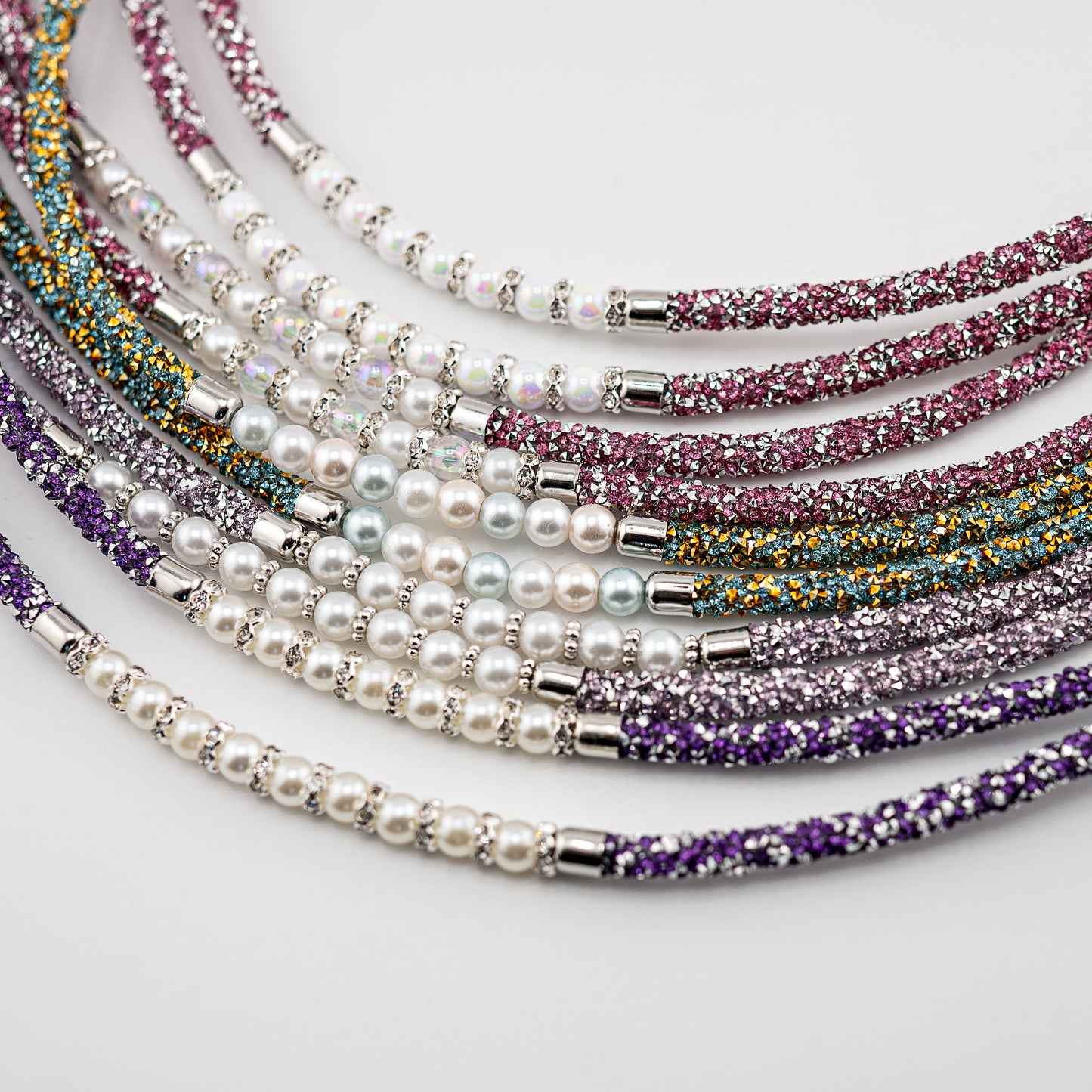 Horse browband Spectrum Double with beads browband by IBV Equine
Experience a new dimension of browband design. Crafted with a pair of soft,
flexible tubes, each generously sprinkled with dazzling rhinestones, this piece offers a unique texture and radiant sparkle. An internal metal wire allows for effortless shaping, ensuring a perfect contour to your horse's brow and maintaining its elegant form.
Each browband is handmade from scratch using premium European materials and durable leather. Featuring o