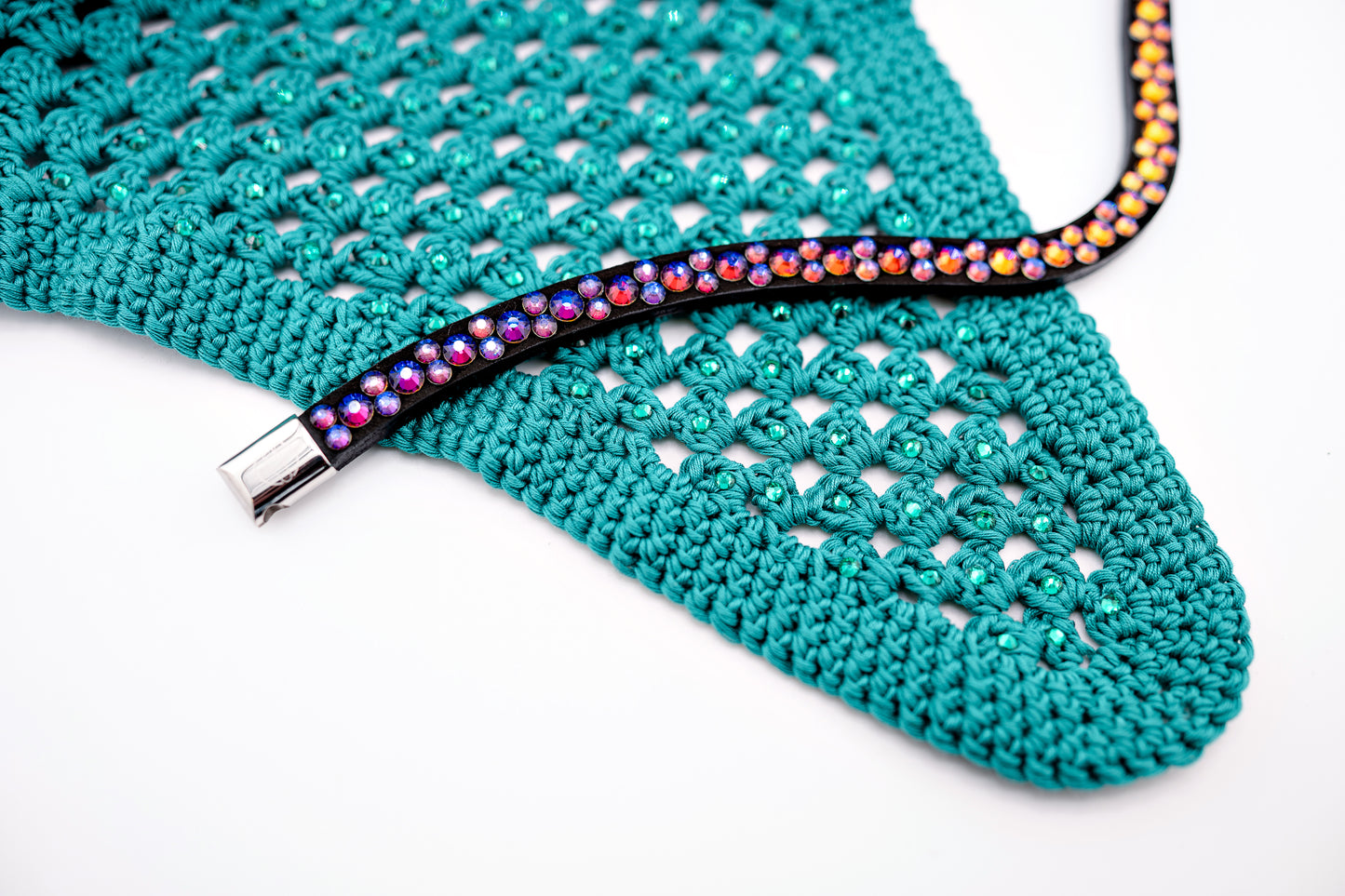 Each rhinestone is meticulously set on a durable nubuck backing, ensuring vibrant sparkle. Our innovative attachment process uses specialized hot glue, creating an incredibly robust bond – so secure, these rhinestones can only be removed with a piece of the leather itself, guaranteeing your browband's beauty withstands the test of time and the rigors of the arena.