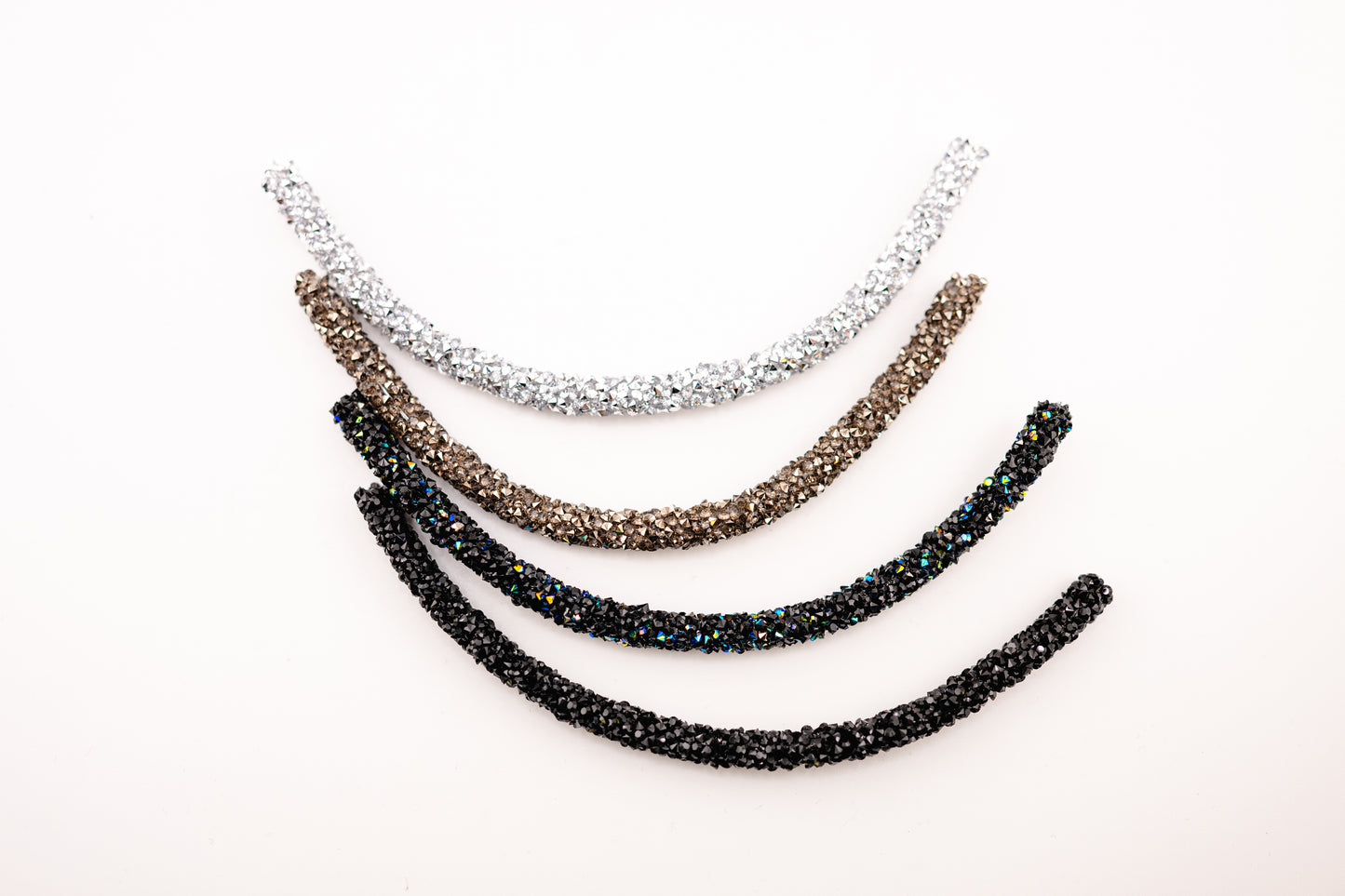 Horse browband Spectrum browband by IBV Equine
Experience a new dimension of browband design. Crafted with a pair of soft,
flexible tubes, each generously sprinkled with dazzling rhinestones, this piece offers a unique texture and radiant sparkle. An internal metal wire allows for effortless shaping, ensuring a perfect contour to your horse's brow and maintaining its elegant form.
Each browband is handmade from scratch using premium European materials and durable leather. Featuring our exclusive magn