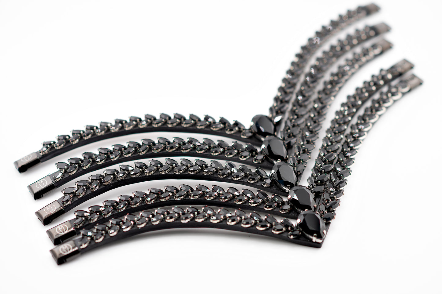 Horse browband Regalia browband by IBV Equine
Experience a new dimension of browband design. Caesar collection browband is a testament to ancient elegance reimagined for modern equestrianism. Its distinctive V-shape features meticulously placed, leaf-like added a large stone in the center for emphasis radiant sparkle.
Each browband is handmade from scratch using premium European materials and durable leather. Featuring our exclusive magnetic snap system,