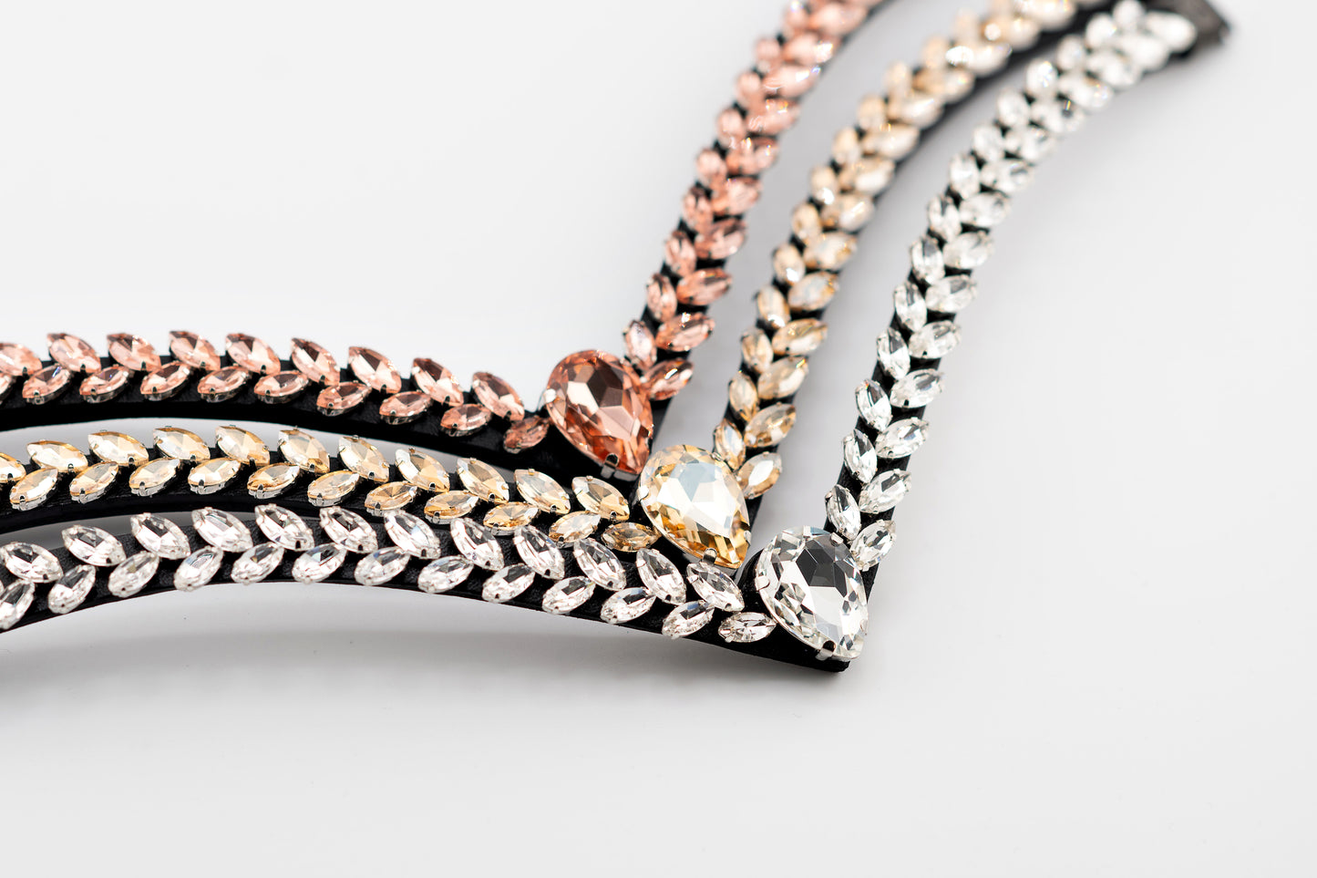 Horse browband Regalia browband by IBV Equine
Experience a new dimension of browband design. Caesar collection browband is a testament to ancient elegance reimagined for modern equestrianism. Its distinctive V-shape features meticulously placed, leaf-like added a large stone in the center for emphasis radiant sparkle.
Each browband is handmade from scratch using premium European materials and durable leather. Featuring our exclusive magnetic snap system,