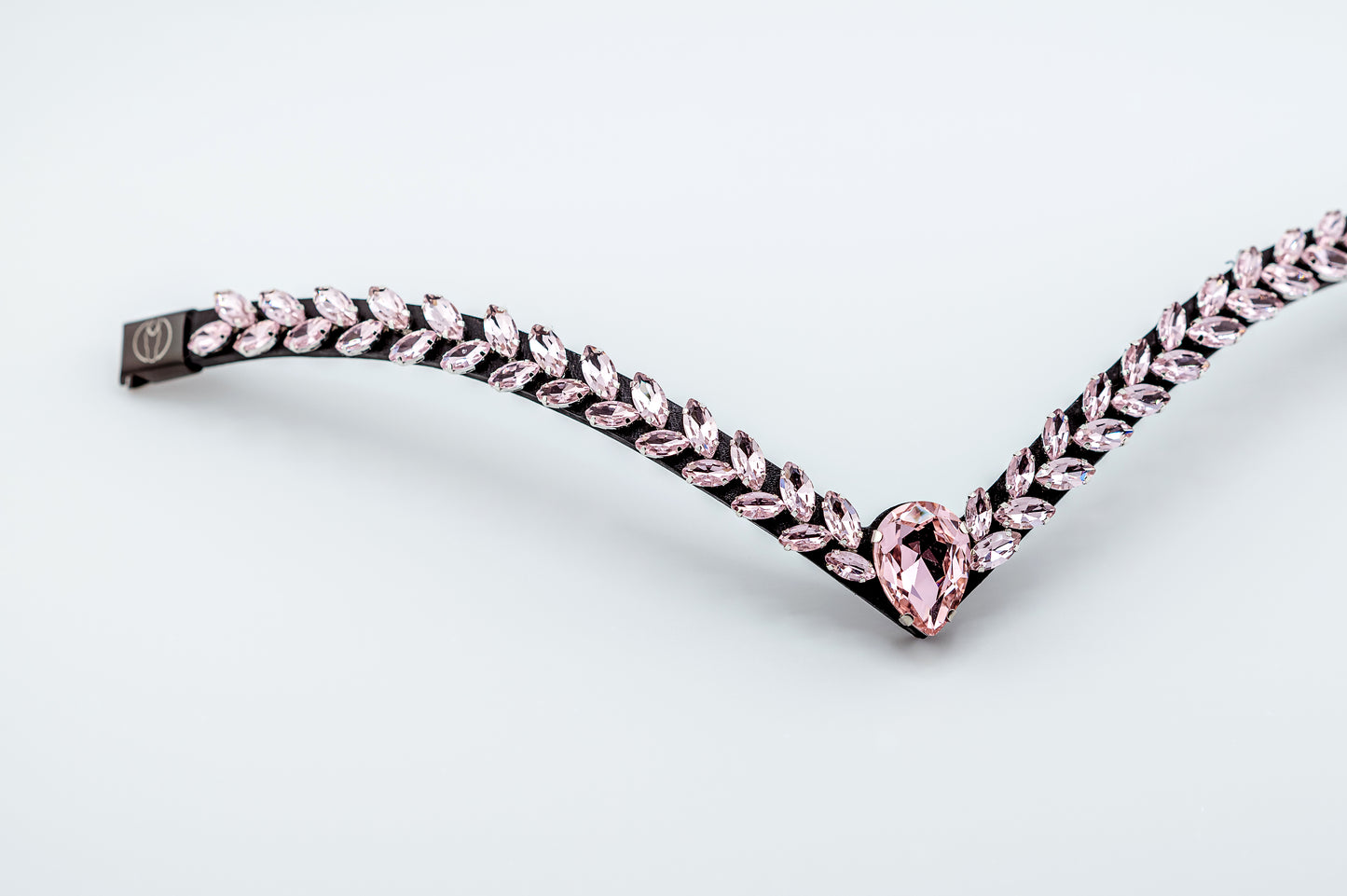 Horse browband Regalia browband by IBV Equine
Experience a new dimension of browband design. Caesar collection browband is a testament to ancient elegance reimagined for modern equestrianism. Its distinctive V-shape features meticulously placed, leaf-like added a large stone in the center for emphasis radiant sparkle.
Each browband is handmade from scratch using premium European materials and durable leather. Featuring our exclusive magnetic snap system,