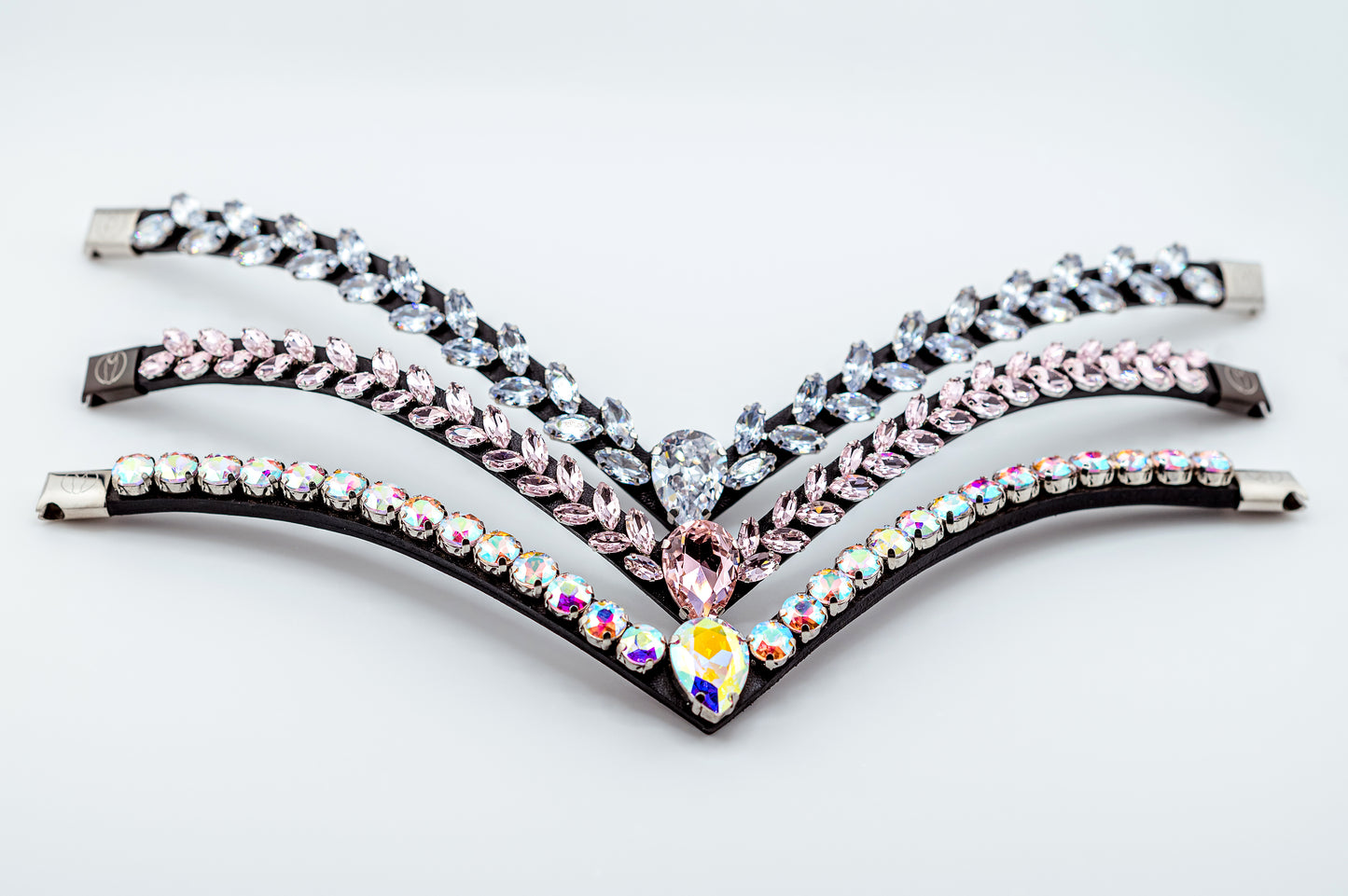 Horse browband Regalia browband by IBV Equine
Experience a new dimension of browband design. Caesar collection browband is a testament to ancient elegance reimagined for modern equestrianism. Its distinctive V-shape features meticulously placed, leaf-like added a large stone in the center for emphasis radiant sparkle.
Each browband is handmade from scratch using premium European materials and durable leather. Featuring our exclusive magnetic snap system,