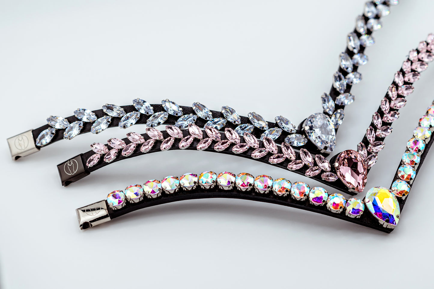 Horse browband Regalia browband by IBV Equine
Experience a new dimension of browband design. Caesar collection browband is a testament to ancient elegance reimagined for modern equestrianism. Its distinctive V-shape features meticulously placed, leaf-like added a large stone in the center for emphasis radiant sparkle.
Each browband is handmade from scratch using premium European materials and durable leather. Featuring our exclusive magnetic snap system,