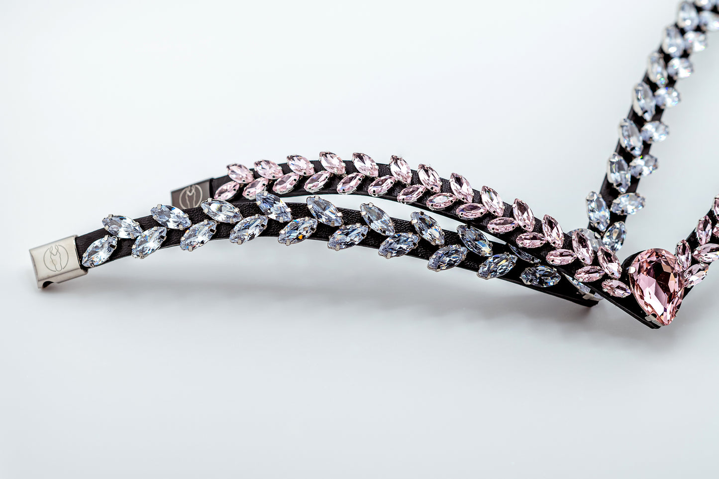 Horse browband Regalia browband by IBV Equine
Experience a new dimension of browband design. Caesar collection browband is a testament to ancient elegance reimagined for modern equestrianism. Its distinctive V-shape features meticulously placed, leaf-like added a large stone in the center for emphasis radiant sparkle.
Each browband is handmade from scratch using premium European materials and durable leather. Featuring our exclusive magnetic snap system,