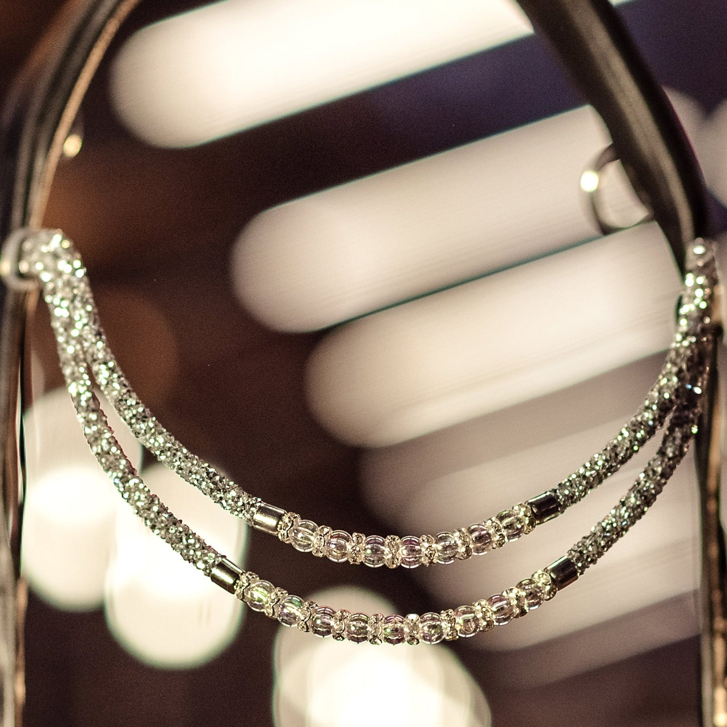 Horse browband Spectrum Double Topaz with beads browband by IBV Equine
Experience a new dimension of browband design. Crafted with a pair of soft,
flexible tubes, each generously sprinkled with dazzling rhinestones, this piece offers a unique texture and radiant sparkle. An internal metal wire allows for effortless shaping, ensuring a perfect contour to your horse's brow and maintaining its elegant form.
Each browband is handmade from scratch using premium European materials and durable leather. Featu