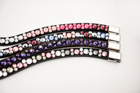 Horse browband Crystal mini  by IBV Equine
Dive into a world of possibilities:
* Combine any colors and sizes from our expansive palette.
* Choose from four distinct rhinestone shapes.
* Explore four unique layout options.
* Select from more than 30 dazzling rhinestone colors.
* Please contact us to create your own design. 

Each rhinestone is meticulously set on a durable nubuck backing, ensuring vibrant sparkle. Our innovative attachment process uses specialized hot glue, creating an incredibly robust bon