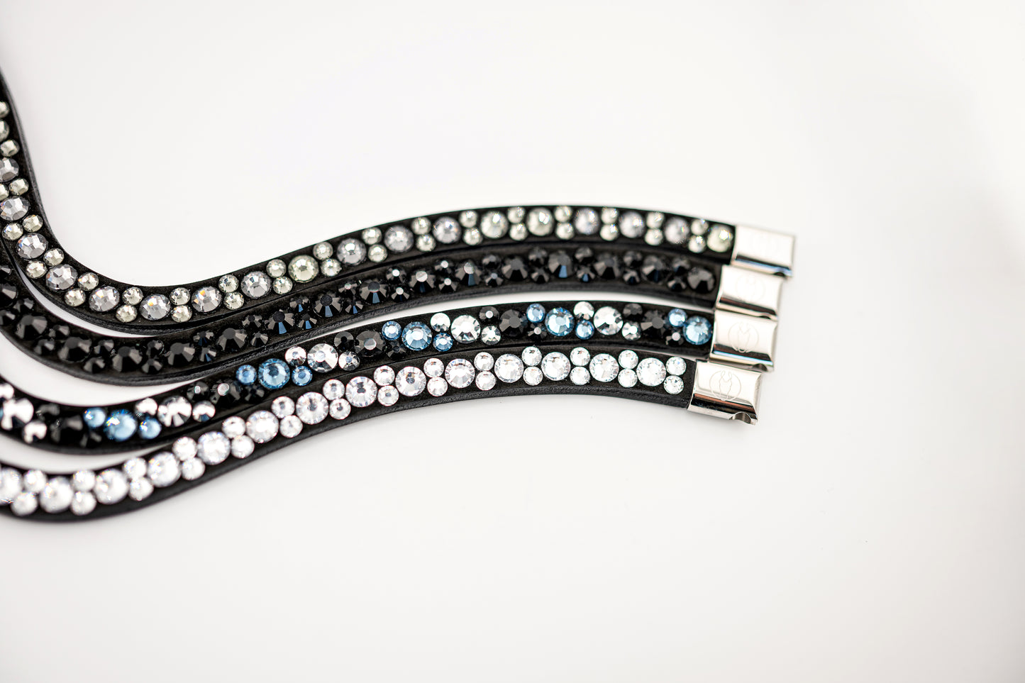 Horse browband Crystal mini  by IBV Equine
Dive into a world of possibilities:
* Combine any colors and sizes from our expansive palette.
* Choose from four distinct rhinestone shapes.
* Explore four unique layout options.
* Select from more than 30 dazzling rhinestone colors.
* Please contact us to create your own design. 

Each rhinestone is meticulously set on a durable nubuck backing, ensuring vibrant sparkle. Our innovative attachment process uses specialized hot glue, creating an incredibly robust bon