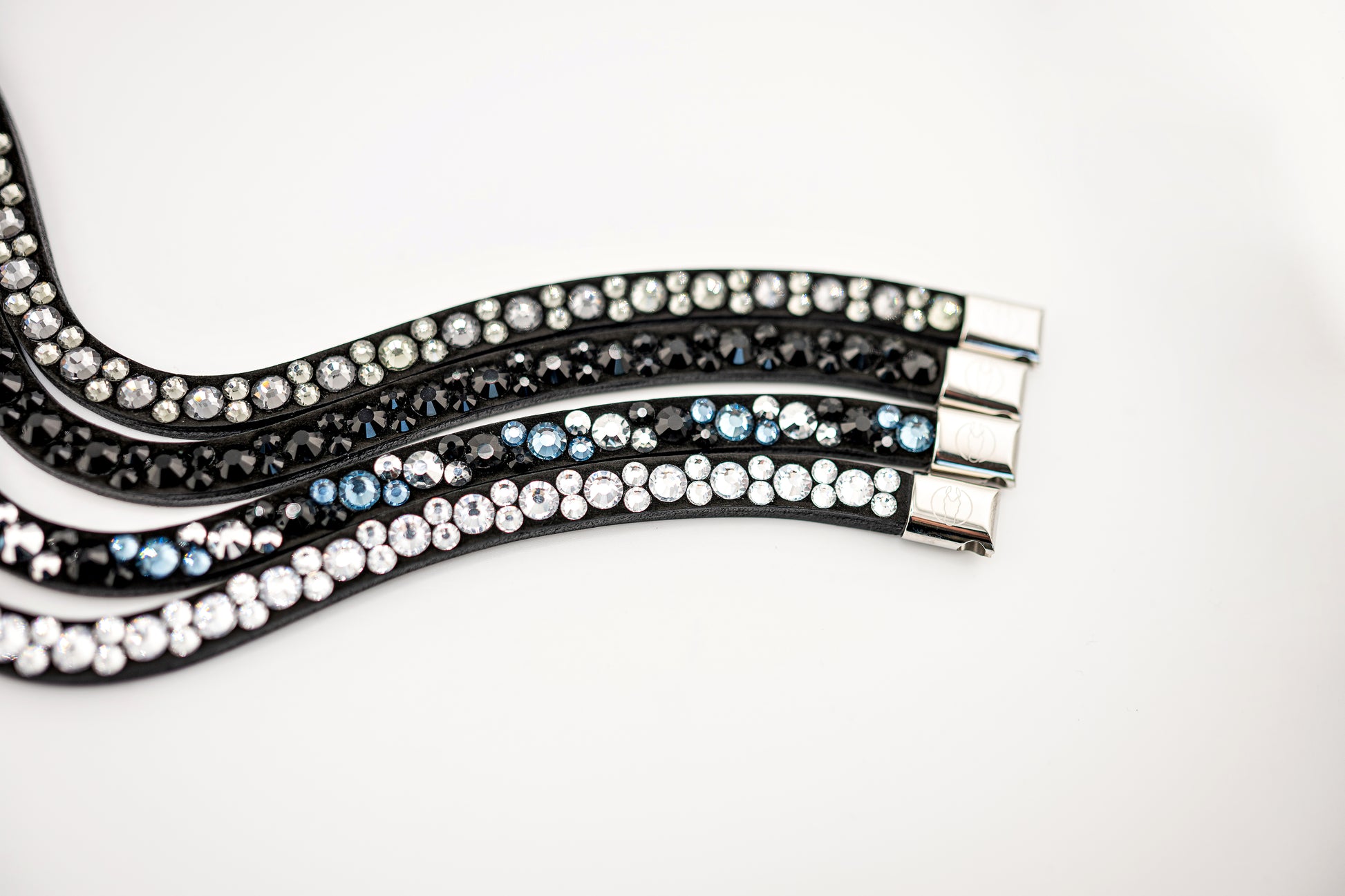 Horse browband Crystal mini  by IBV Equine
Dive into a world of possibilities:
* Combine any colors and sizes from our expansive palette.
* Choose from four distinct rhinestone shapes.
* Explore four unique layout options.
* Select from more than 30 dazzling rhinestone colors.
* Please contact us to create your own design. 

Each rhinestone is meticulously set on a durable nubuck backing, ensuring vibrant sparkle. Our innovative attachment process uses specialized hot glue, creating an incredibly robust bon
