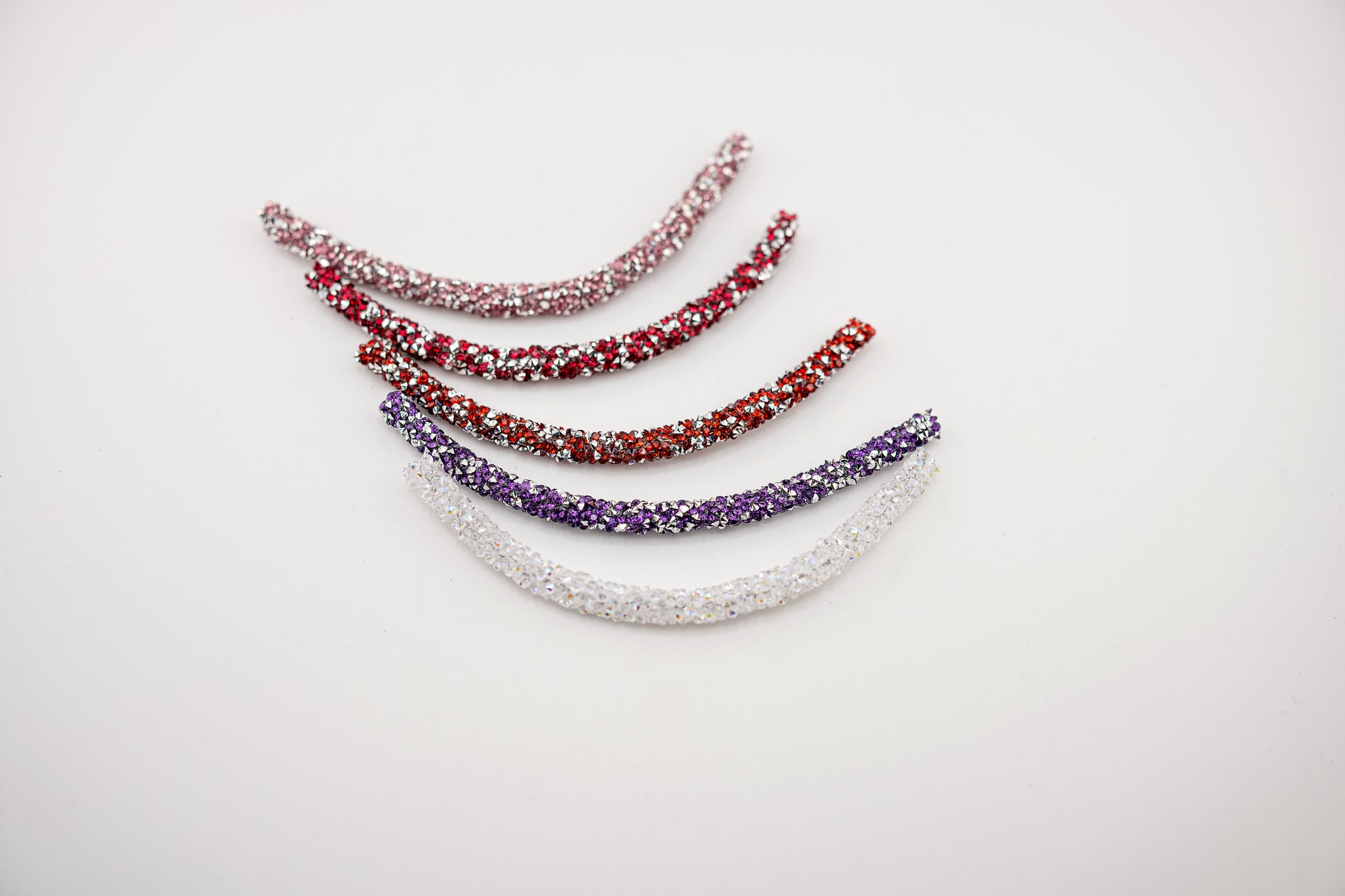 Horse browband Spectrum  browband  by IBV Equine
Experience a new dimension of browband design. Crafted with a pair of soft,
flexible tubes, each generously sprinkled with dazzling rhinestones, this piece offers a unique texture and radiant sparkle. An internal metal wire allows for effortless shaping, ensuring a perfect contour to your horse's brow and maintaining its elegant form.
Each browband is handmade from scratch using premium European materials and&nbsp;durable leather. Featuring our exclusive magn