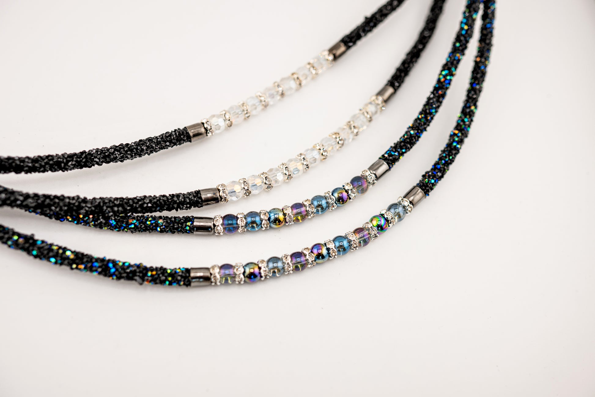 Horse browband Spectrum Double with beads browband  by IBV Equine
Experience a new dimension of browband design. Crafted with a pair of soft,
flexible tubes, each generously sprinkled with dazzling rhinestones, this piece offers a unique texture and radiant sparkle. An internal metal wire allows for effortless shaping, ensuring a perfect contour to your horse's brow and maintaining its elegant form.
Each browband is handmade from scratch using premium European materials and&nbsp;durable leather. Featuring o