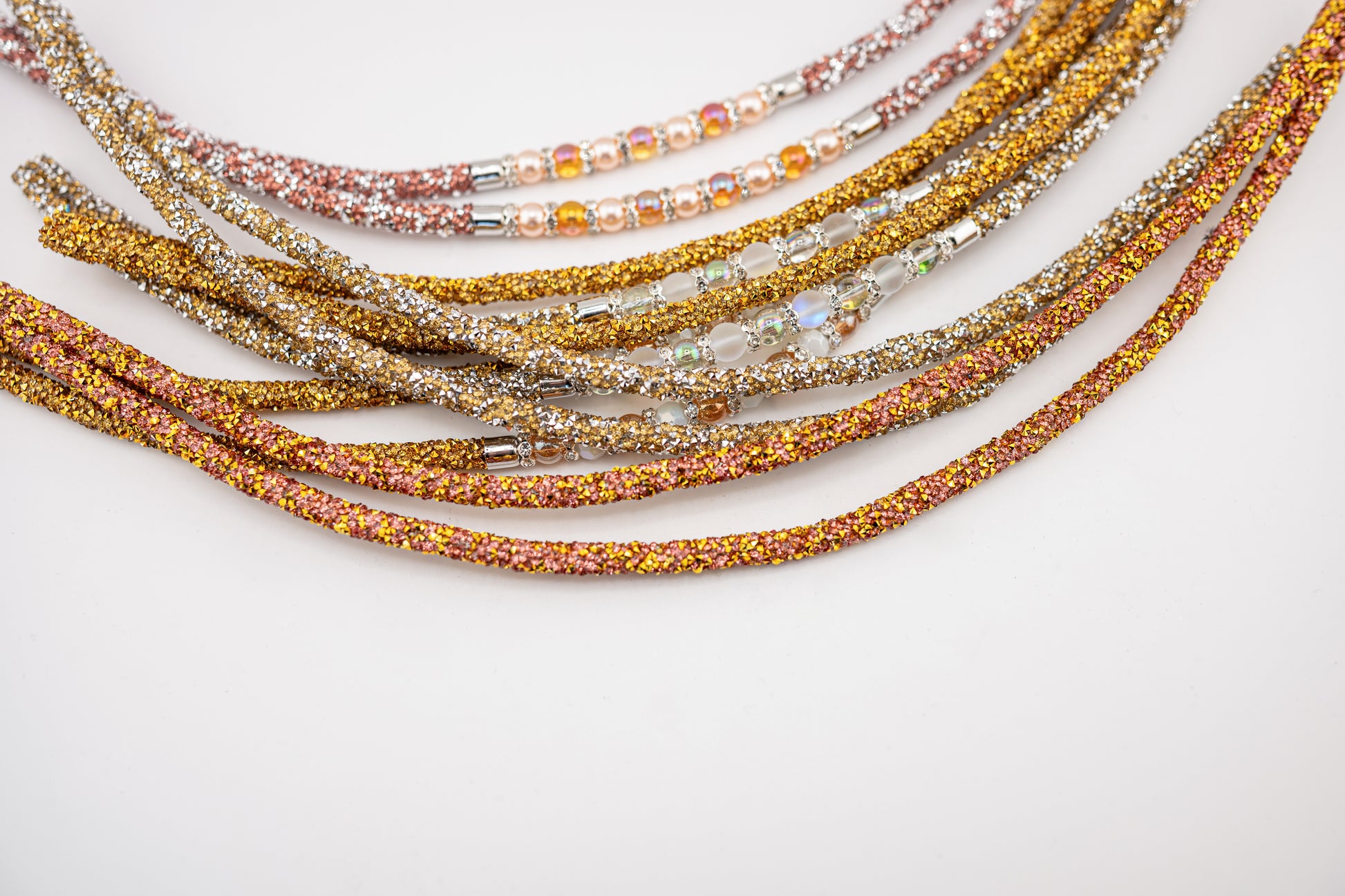 Horse browband Spectrum Double with beads browband  by IBV Equine
Experience a new dimension of browband design. Crafted with a pair of soft,
flexible tubes, each generously sprinkled with dazzling rhinestones, this piece offers a unique texture and radiant sparkle. An internal metal wire allows for effortless shaping, ensuring a perfect contour to your horse's brow and maintaining its elegant form.
Each browband is handmade from scratch using premium European materials and&nbsp;durable leather. Featuring o