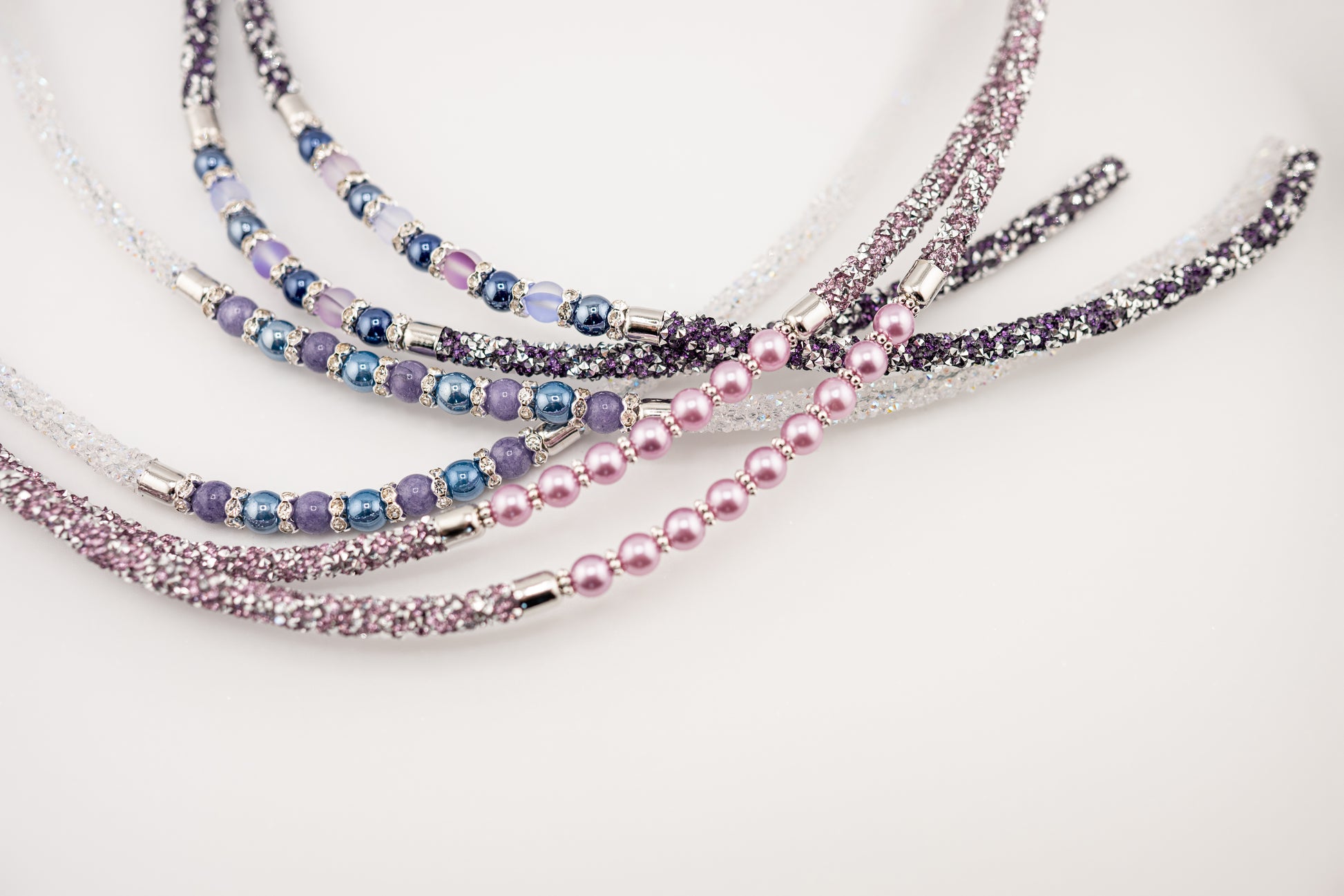 Horse browband Spectrum Double with beads browband  by IBV Equine
Experience a new dimension of browband design. Crafted with a pair of soft,
flexible tubes, each generously sprinkled with dazzling rhinestones, this piece offers a unique texture and radiant sparkle. An internal metal wire allows for effortless shaping, ensuring a perfect contour to your horse's brow and maintaining its elegant form.
Each browband is handmade from scratch using premium European materials and&nbsp;durable leather. Featuring o
