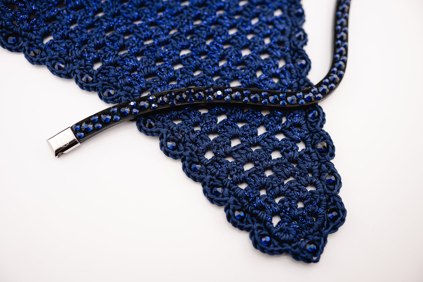 Horse browband Crystal mini  by IBV Equine
Dive into a world of possibilities:
* Combine any colors and sizes from our expansive palette.
* Choose from four distinct rhinestone shapes.
* Explore four unique layout options.
* Select from more than 30 dazzling rhinestone colors.
* Please contact us to create your own design. 

Each rhinestone is meticulously set on a durable nubuck backing, ensuring vibrant sparkle. Our innovative attachment process uses specialized hot glue, creating an incredibly robust bon