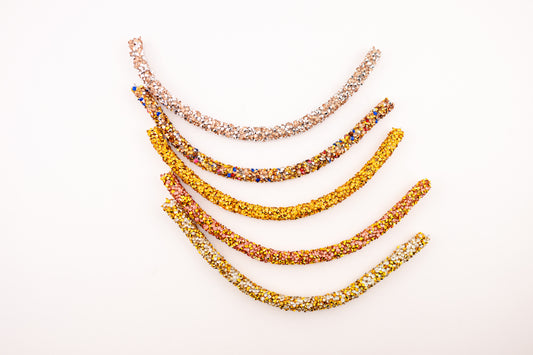 Horse browband Spectrum  browband  by IBV Equine
Experience a new dimension of browband design. Crafted with a pair of soft,
flexible tubes, each generously sprinkled with dazzling rhinestones, this piece offers a unique texture and radiant sparkle. An internal metal wire allows for effortless shaping, ensuring a perfect contour to your horse's brow and maintaining its elegant form.
Each browband is handmade from scratch using premium European materials and&nbsp;durable leather. Featuring our exclusive magn