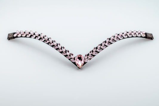 Horse browband Regalia browband  by IBV Equine
Experience a new dimension of browband design. Caesar collection browband is a testament to ancient elegance reimagined for modern equestrianism. Its distinctive V-shape features meticulously placed, leaf-like added a large stone in the center for emphasis radiant sparkle. 
Each browband is handmade from scratch using premium European materials and durable leather. Featuring our exclusive magnetic snap system,
