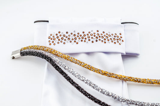 Horse browband Spectrum  browband  by IBV Equine
Experience a new dimension of browband design. Crafted with a pair of soft,
flexible tubes, each generously sprinkled with dazzling rhinestones, this piece offers a unique texture and radiant sparkle. An internal metal wire allows for effortless shaping, ensuring a perfect contour to your horse's brow and maintaining its elegant form.
Each browband is handmade from scratch using premium European materials and&nbsp;durable leather. Featuring our exclusive magn